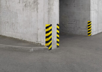black and yellow restriction sign on the corner of an industrial building or entrance to a parking...