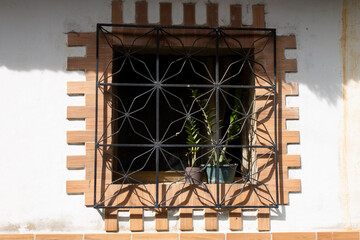 Windows on the facades of colonial houses in San Agustín del Sur in Caracas, Venezuela