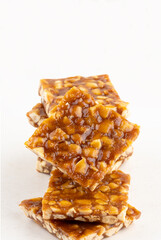 Brazilian pé de moleque or boy foot isolated on white background.