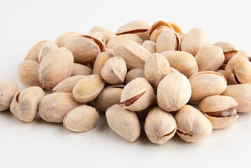 Pile of pistachio isolated on white background.