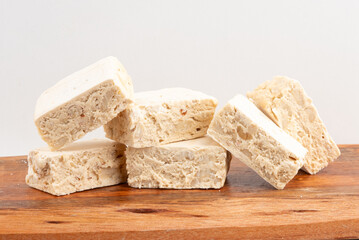 Pile of nougats on cutting board. Selective focus.