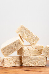 Traditional pile of nougats on white background.