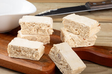 Typical Italian nougats on cutting board. Selective focus.