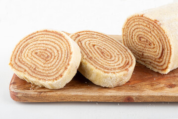 Traditional northeast roll cake isolated on white background.