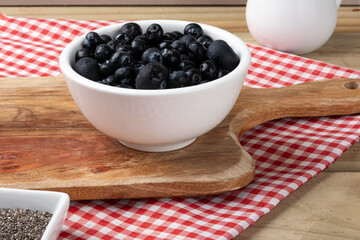 Ripe blueberries in a bowl. Selective focus.