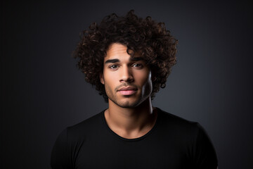 Portrait of attractive confident young man relaxed and serious on black background. Generative AI.