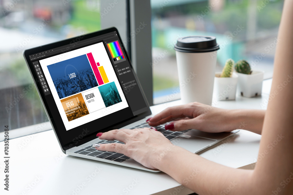 Poster graphic designer software for modern design of web page and commercial ads showing on the computer s