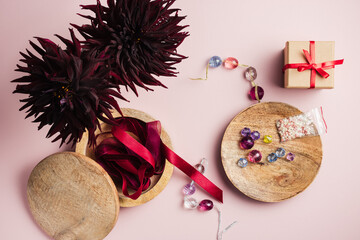Multicolored beads, satin ribbons for needlework.