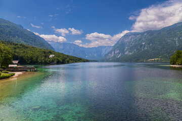 Fototapeta na wymiar Lake Bohinj a large lake in Slovenia, is located in the Bohinj Valley of the Julian Alps, in the northwestern region of Upper Carniola, part of the Triglav National Park