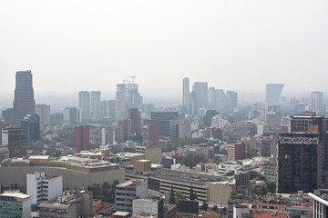 Fototapeta premium Panoramic view of the city and air pollution, global warming concept