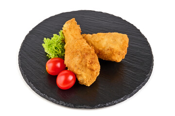 Breaded crispy chicken legs with ketchup, isolated on white background.