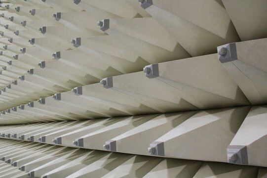 Soft hybrid pyramidal microwave and radio frequency absorbers close up. Electromagnetic compatibility measurements absorbers in anechoic chamber with soundproof walls for scientific experiments