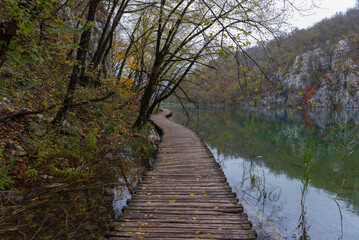 Fototapeta na wymiar Plitvice Lakes National Park in Croatia. Paths between the azure green lakes