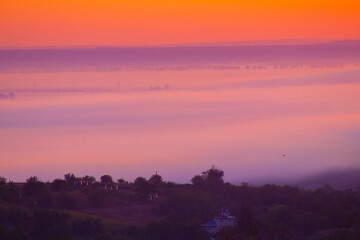 Fototapeta premium Sunrise landscape, colorful warm cold nature, world, river, hills and village