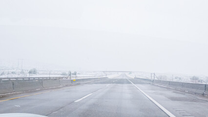 Fototapeta premium Braving a Winter Storm Driving Through Western Colorado