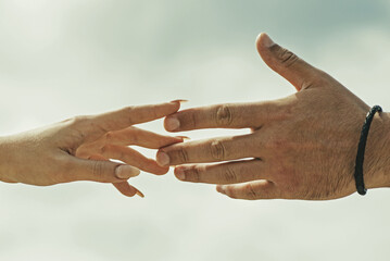 Couple hands. Helping hand. Holding hand, close up. Giving a help hand. Rescue, helping gesture or hands. Salvation relations. Help gesture or hands. Support hand.