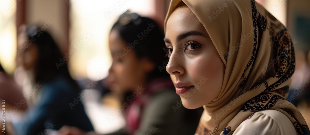 Poster muslim female student in hijab, studying in diverse university with multiethnic classmates. asks sch
