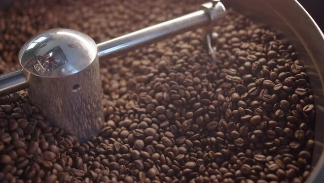 Close up of mixing coffee seeds. Fragrant and roasted coffee beans, hot aroma coffee and organic freshness, roast coffee