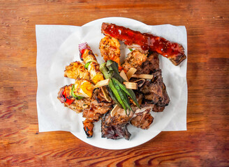 Skewers set satay with mayonnaise dip sauce served in dish isolated on wooden table top view of...