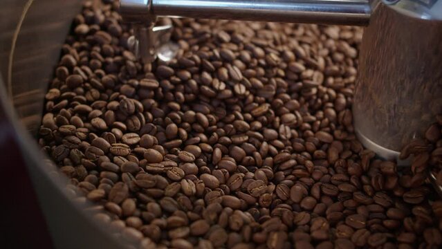 Close up of mixing coffee seeds. Fragrant and roasted coffee beans, hot aroma coffee and organic freshness, roast coffee