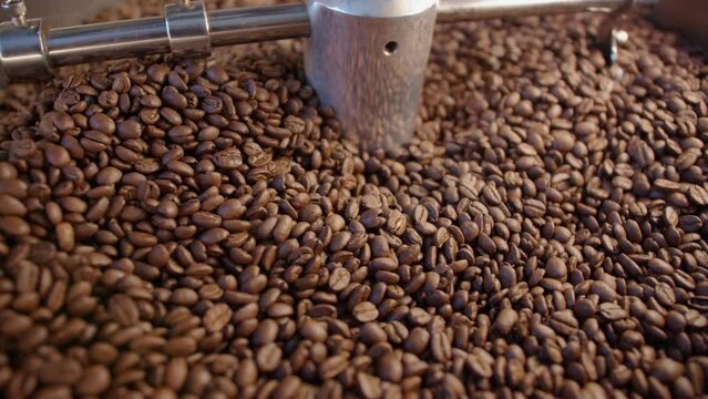 Close up of mixing coffee seeds. Fragrant and roasted coffee beans, hot aroma coffee and organic freshness, roast coffee