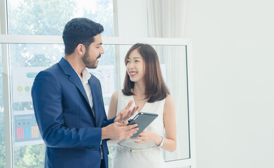 Portrait business team woman girl cute and man handsome Asian two people meeting standing looking hand holding laptop ready for presen creative idea job work success online sale inside office