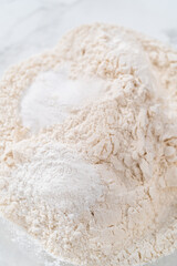 Lemon poppy seed muffins garnished with almond slivers