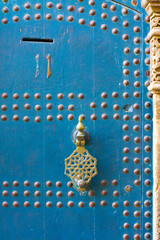 Old wooden door with rivets in the kasbah of Tangier