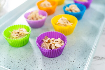 Lemon poppy seed muffins garnished with almond slivers