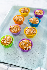 Lemon poppy seed muffins garnished with almond slivers