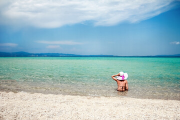 happy girl at sea in greece on sand nature