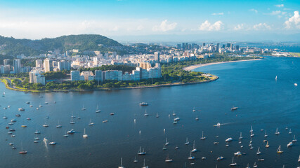 The stunning landscape of the modern city over the ocean with yachts in Rio de Janeiro.