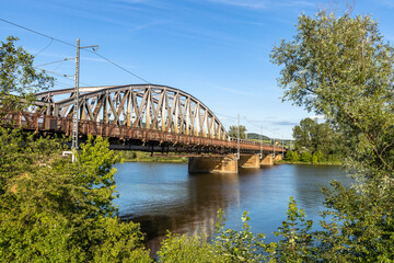 Fototapeta premium Old steel railway bridge over the river Váh, in Púchov, Slovakia.