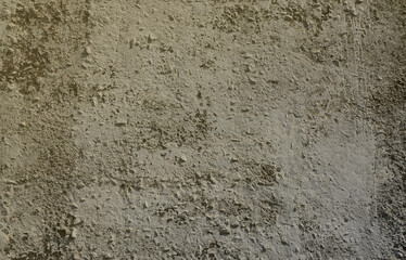 Texture of the old embossed concrete wall in gray color. Background image of a concrete product