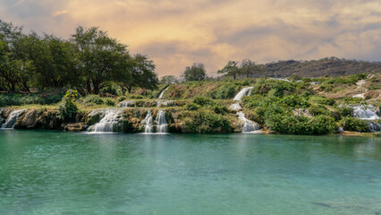 Fototapeta na wymiar mini Waterfalls at Wadi Darbat in the Dhofar region of Oman