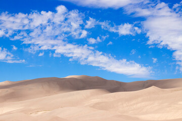 Fototapeta na wymiar Sand Dunes with Blue Sky