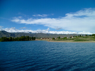 At lake Issyk-Kul, with Tian Shan Mountains