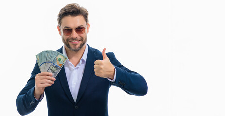 Man showing cash money in dollar banknotes. Portrait of business man isolated on white studio banner. Successful winner celebrating success or victory with money bills.