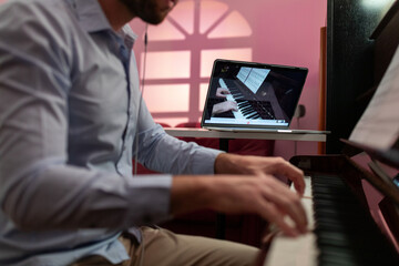Man Teaching Piano Music Tutorial With Remote Video Streaming