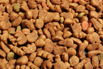 Dry pet food as background, closeup