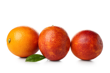 Whole tasty blood oranges on white background