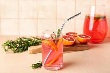 Glass of tasty blood orange lemonade on table
