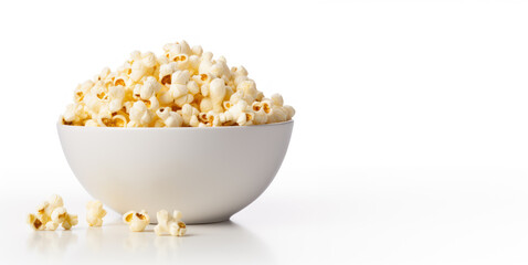 Fototapeta na wymiar Popcorn in a white bowl on a white background with copy space
