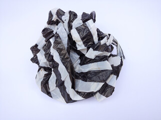 Black and white striped plastic bag isolated on white background