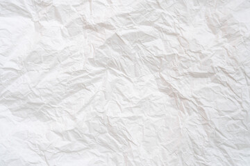Wrinkled or crumpled white stencil or tissue paper used for crumpled paper background texture..