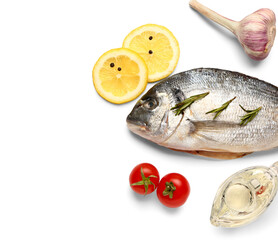 Raw dorado fish with lemon and vegetables on white background