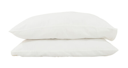 White pillows with case in stack after guest's use at hotel or resort room isolated with clipping...