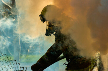 Firefighter surrounded by smoke