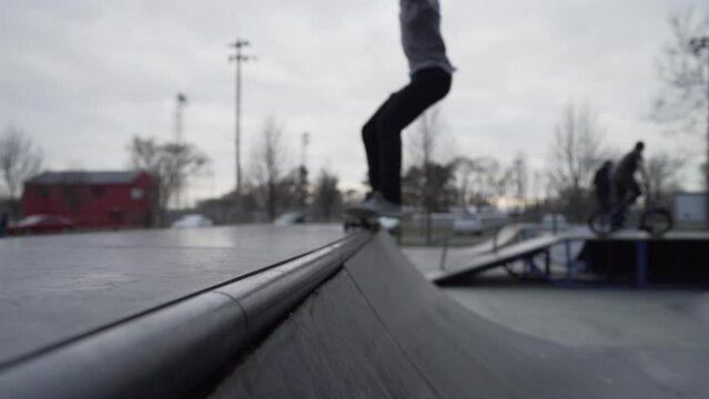 skateboard grind on halfpipe in slow motion