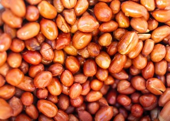 Pile of fried peanuts in the background